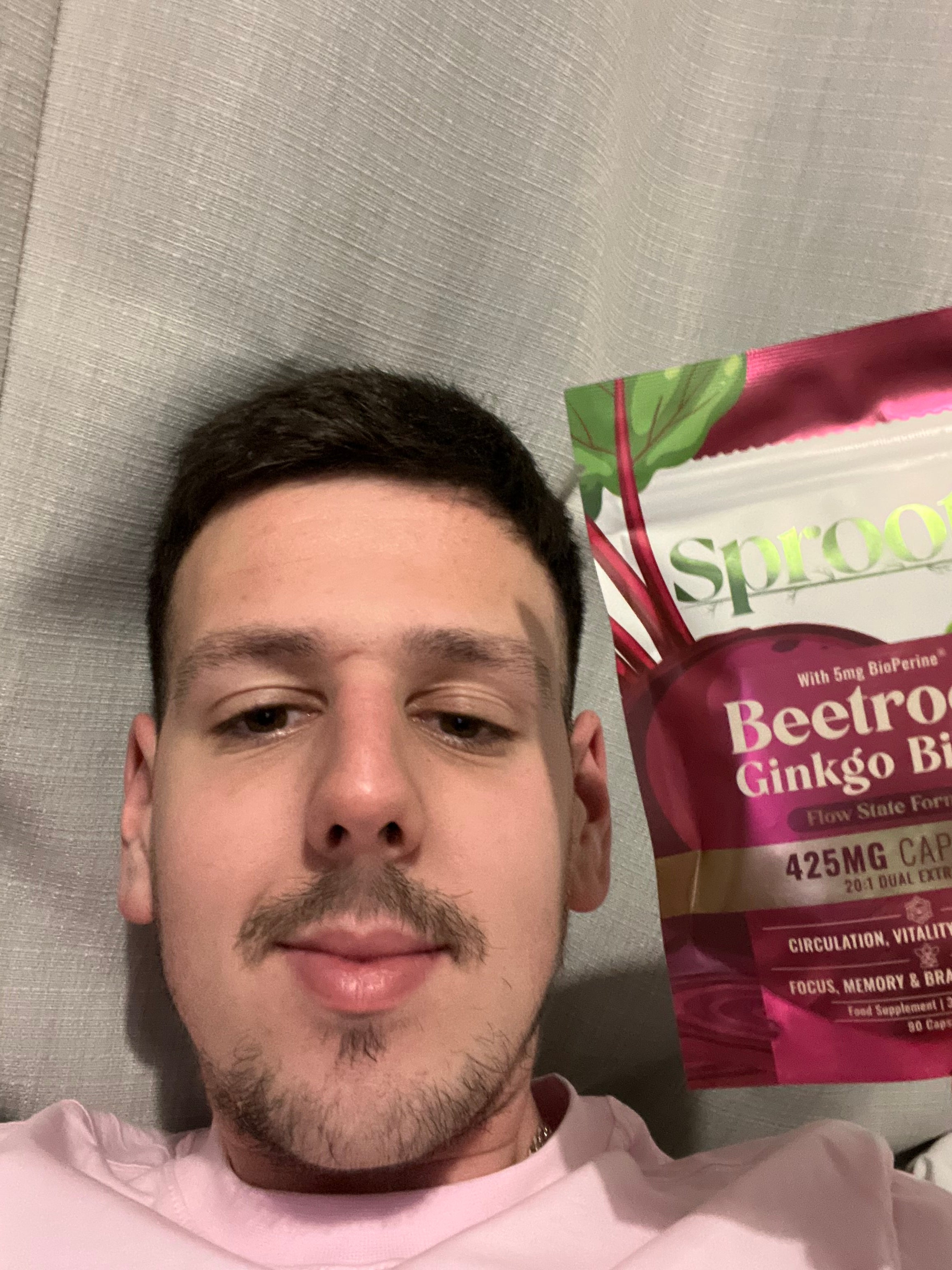 Sproote customer holding a Flow State Beetroot and Ginkgo Biloba pouch